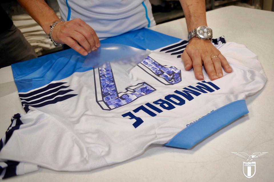 Fans faces printed onto the back of Immobile's kit, Source- Official S.S.Lazio