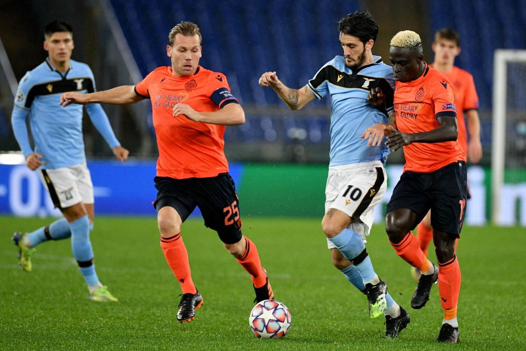 ROME, ITALY - DECEMBER 08: Luis Alberto of SS Lazio compete for the ball with Ruud Vormer and Krépin Diatta of Club Brugge during the UEFA Champions League Group F stage match between SS Lazio and Club Brugge KV at Stadio Olimpico on December 08, 2020 in Rome, Italy. Sporting stadiums around Italy remain under strict restrictions due to the Coronavirus Pandemic as Government social distancing laws prohibit fans inside venues resulting in games being played behind closed doors. (Photo by Marco Rosi - SS Lazio/Getty Images)