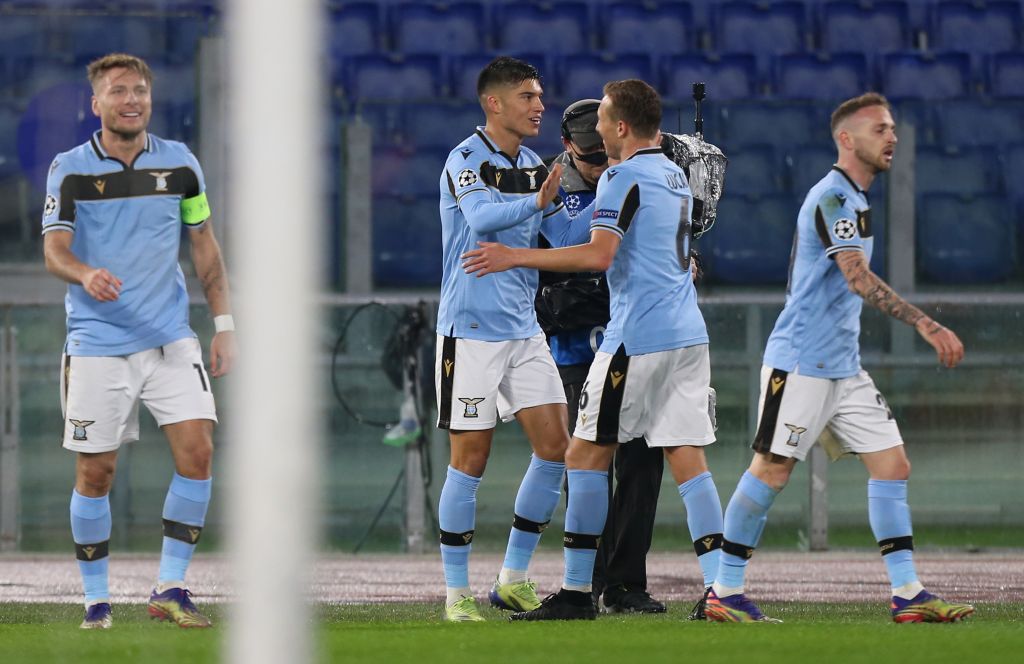 ROME, ITALY - DECEMBER 08: Joaquin Correa of SS Lazio celebrates with teammate Lucas Leiva of SS Lazio after scoring their team's first goal during the UEFA Champions League Group F stage match between SS Lazio and Club Brugge KV at Stadio Olimpico on December 08, 2020 in Rome, Italy. Sporting stadiums around Italy remain under strict restrictions due to the Coronavirus Pandemic as Government social distancing laws prohibit fans inside venues resulting in games being played behind closed doors. (Photo by Paolo Bruno/Getty Images)