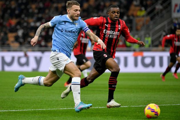 Ciro Immobile of SS Lazio competes for the ball with Pierre Kalulu of AC Milan during the Coppa Italia match between AC Milan ac SS Lazio at Stadio Giuseppe Meazza on February 09, 2022 in Milan, Italy