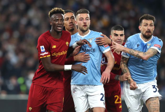 ROME, ITALY - MARCH 20: Tammy Abraham of AS Roma and Sergej Milinkovic-Savic of SS Lazio react during the Serie A match between AS Roma and SS Lazio at Stadio Olimpico on March 20, 2022 in Rome, Italy. (Photo by Paolo Bruno/Getty Images)