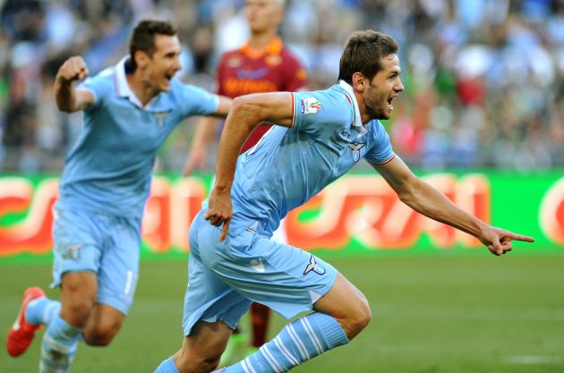 In the Derby della Capitale, Lazio defender Senad Lulic (C) celebrates with Lazio's German forward Miroslav Klose (L) after scoring during the Italian Cup football final between AS Roma and Lazio at the Olympic Stadium in Rome on May 26, 2013. AFP PHOTO / TIZIANA FABI AFP/AFP/TIZIANA FABI/STR /VIP/MM (Photo credit should read TIZIANA FABI/AFP via Getty Images)