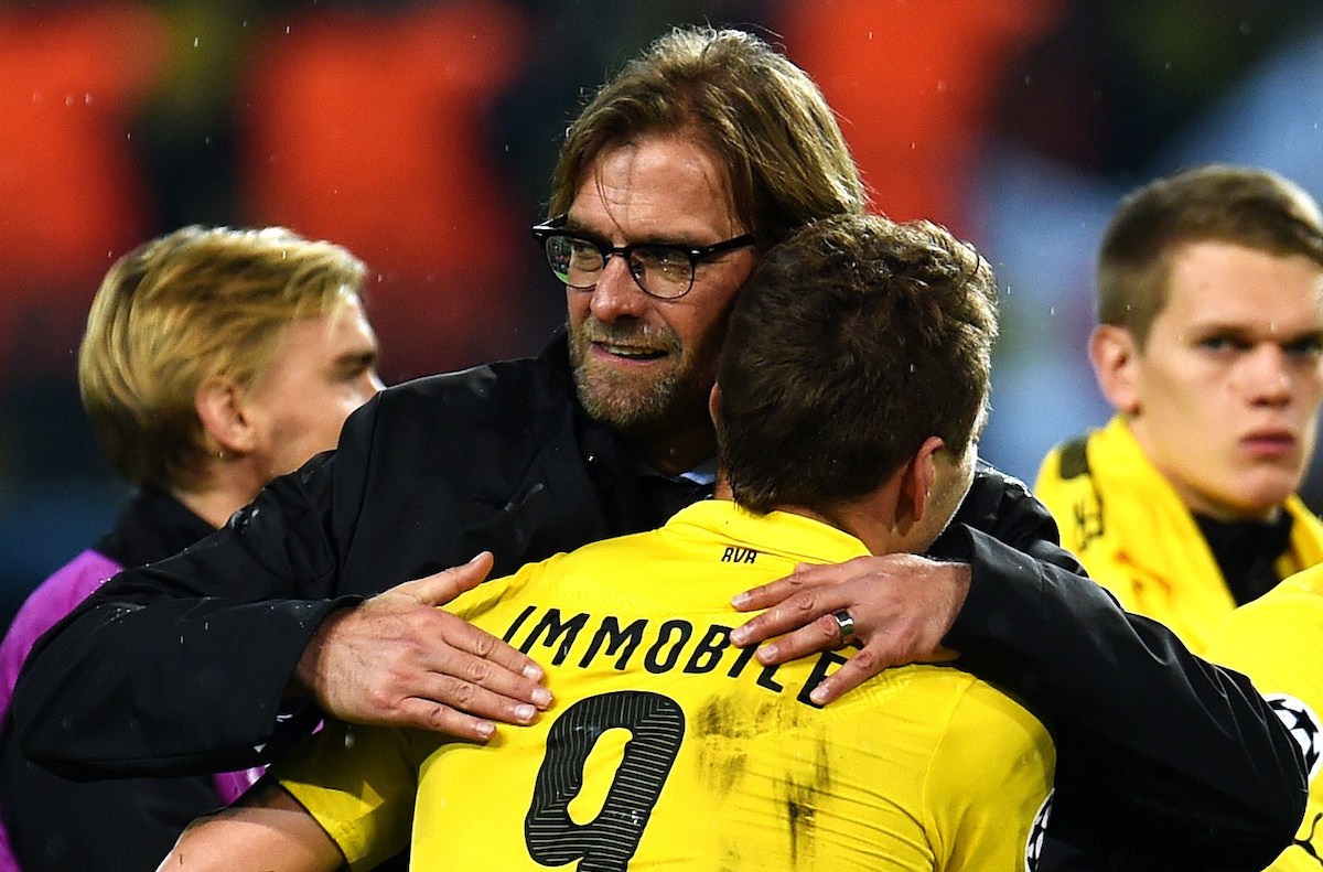 Dortmund head coach Jurgen Klopp celebrates with Italian striker Ciro Immobile after the UEFA Champions League second-leg Group D football match Borussia Dortmund vs Galatasaray AS in Dortmund, western Germany on November 4, 2014. Dortmund won the match 4-1. AFP PHOTO / PATRIK STOLLARZ (Photo credit should read PATRIK STOLLARZ/AFP via Getty Images)