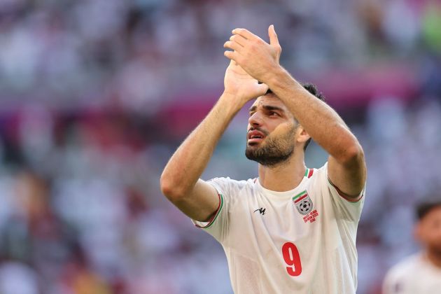 Iran forward #09 Mehdi Taremi applauds as he celebrates at the end of the Qatar 2022 World Cup Group B football match between Wales and Iran at the Ahmad Bin Ali Stadium in Al-Rayyan, west of Doha on November 25, 2022. (Photo by Giuseppe CACACE / AFP) (Photo by GIUSEPPE CACACE/AFP via Getty Images)