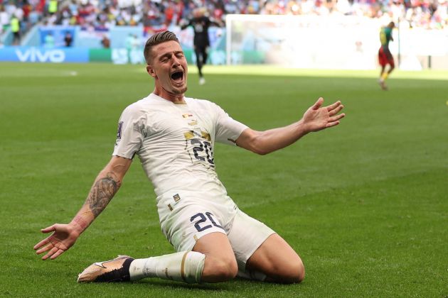 Serbia midfielder Sergej Milinkovic-Savic celebrates scoring his team's second goal during the Qatar 2022 World Cup Group G football match between Cameroon and Serbia at the Al-Janoub Stadium in Al-Wakrah, south of Doha on November 28, 2022. (Photo by ADRIAN DENNIS / AFP) (Photo by ADRIAN DENNIS/AFP via Getty Images)