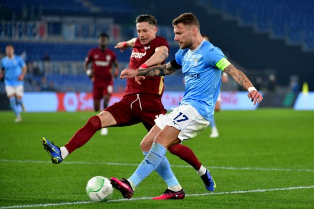 ROME, ITALY - FEBRUARY 16: Ciro Immobile of SS Lazio compete for the ball with Ciprian Deac of CFR Cluj during the UEFA Europa Conference League knockout round play-off leg one match between SS Lazio and CFR Cluj at Stadio Olimpico on February 16, 2023 in Rome, Italy. (Photo by Marco Rosi/Getty Images)