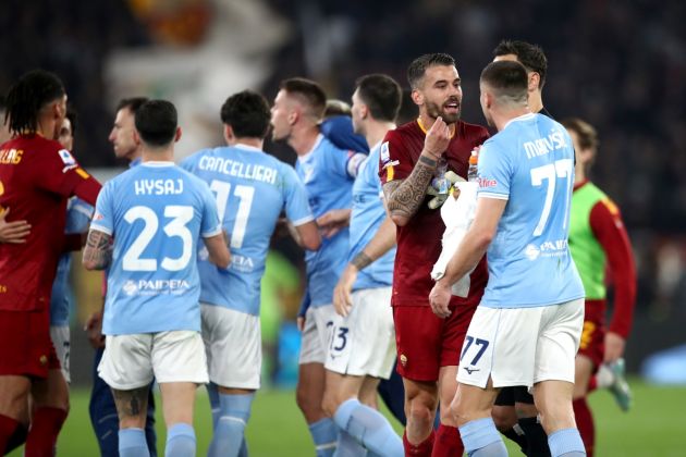 ROME, ITALY - MARCH 19: Leonardo Spinazzola of AS Roma speaks with Adam Marusic of SS Lazio during the Serie A match between SS Lazio and AS Roma at Stadio Olimpico on March 19, 2023 in Rome, Italy. (Photo by Paolo Bruno/Getty Images)