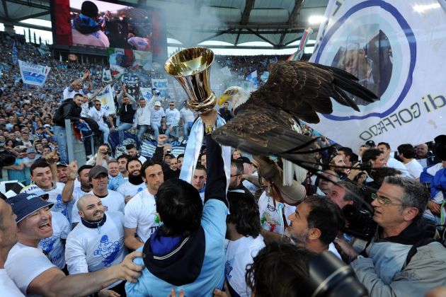 ROME, ITALY - MAY 26: Lazio mascot Olimpia, a female American golden eagle, is held with Tim Cup after the TIM cup final match between AS Roma v SS Lazio at Stadio Olimpico on May 26, 2013 in Rome, Italy. (Photo by Giuseppe Bellini/Getty Images)