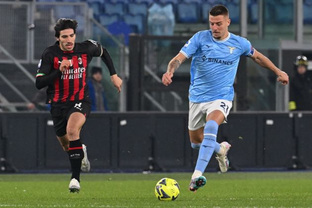 Lazio midfielder Sergej Milinkovic-Savic challenges Milan midfielder Sandro Tonali (L) during the Italian Serie A football match between Lazio and AC Milan on January 24, 2023 at the Olympic stadium in Rome. (Photo by Andreas SOLARO / AFP) (Photo by ANDREAS SOLARO/AFP via Getty Images)