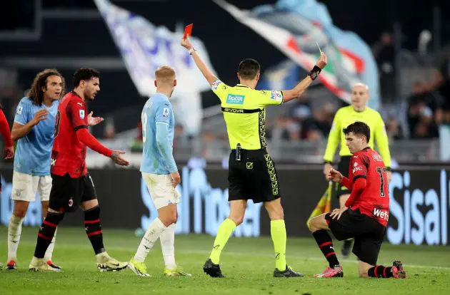 ROME, ITALY - MARCH 01: Referee Marco Di Bello shows a red card to Matteo Guendouzi of SS Lazio as Christian Pulisic of AC Milan is shown a yellow card during the Serie A TIM match between SS Lazio and AC Milan - Serie A TIM at Stadio Olimpico on March 01, 2024 in Rome, Italy. (Photo by Paolo Bruno/Getty Images)