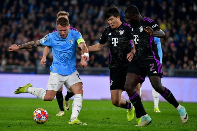 ROME, ITALY - FEBRUARY 14: Ciro Immobile of SS Lazio compete for the ball with Minjae Kim of Bayern Muchen during the UEFA Champions League 2023/24 round of 16 first leg match between SS Lazio and FC Bayern München at Stadio Olimpico on February 14, 2024 in Rome, Italy. (Photo by Marco Rosi - SS Lazio/Getty Images)