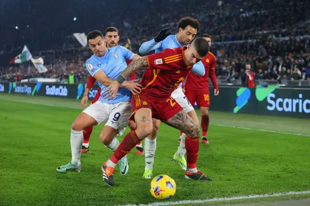 ROME, ITALY - JANUARY 10: Gianluca Mancini of AS Roma is challenged by Pedro (L) and Felipe Anderson of SS Lazio during the Coppa Italia match between SS Lazio and AS Roma at Stadio Olimpico on January 10, 2024 in Rome, Italy. (Photo by Paolo Bruno/Getty Images)